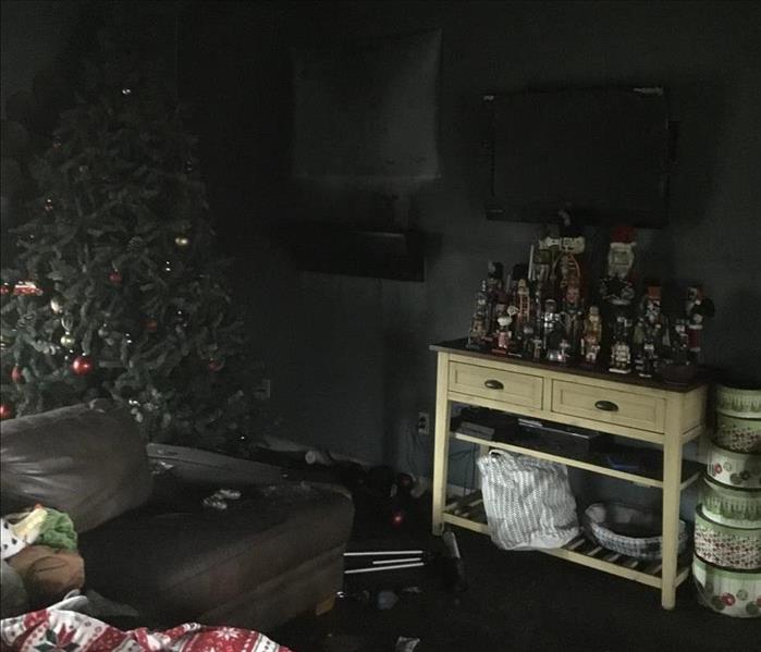 Cluttered, burnt looking living room 