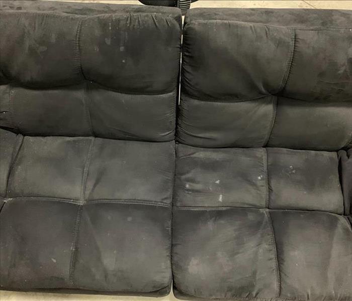 Futon covered in fire soot and ashes 