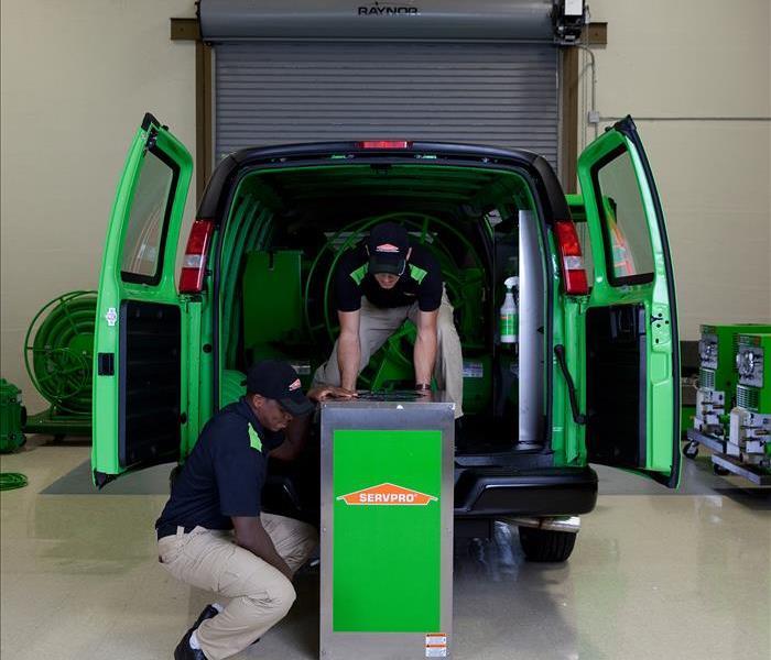 SERVPRO Vehicle with Workers unloading equipment