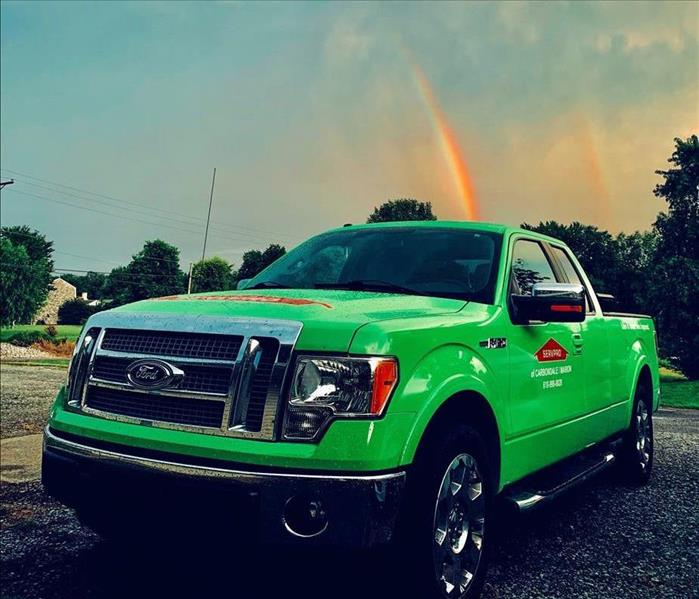 SERVPRO Truck with Rainbow in the Sky Behind The Truck
