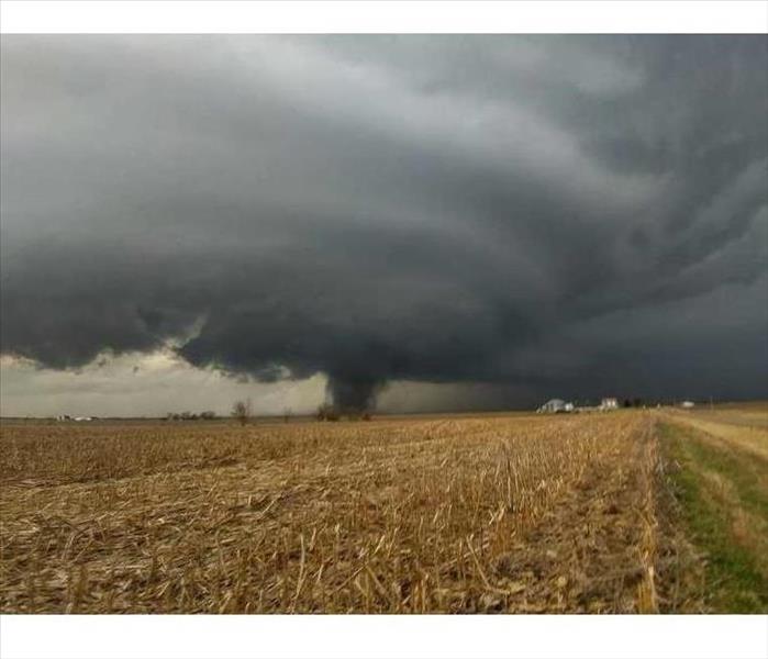 Huge storm cloud over a field