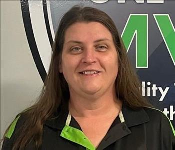 SERVPRO employee in front of MVP sign