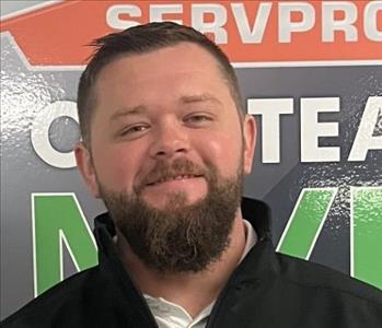 SERVPRO employee in front of MVP sign